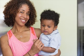 Portrait of smiling mixed race mother and baby son