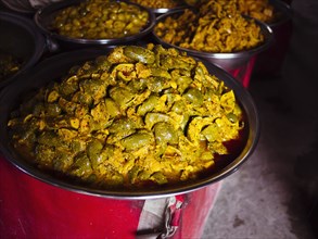 Bowls of fresh pickled mango for sale in market