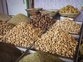 Bins of nuts and grains for sale in market