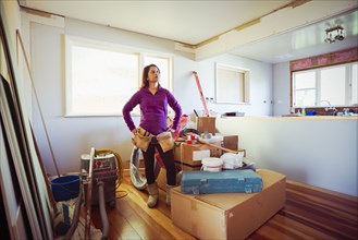 Mixed race woman surveying remodeling project