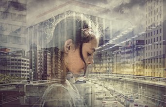 Double exposure of mixed race girl and busy cityscape