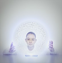 Mixed race girl holding sphere from digital tablet