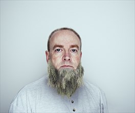 Caucasian man wearing tree beard