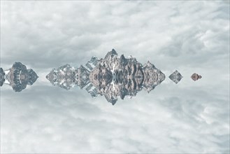 Mirror image of mountains and clouds
