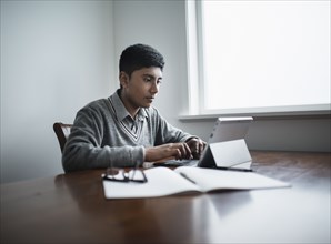 Fiji Indian boy using digital tablet