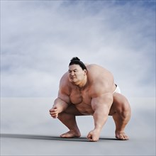 Sumo wrestler crouching
