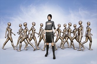 Portrait of woman standing in front of walking robots