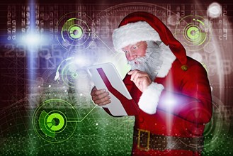 Santa using futuristic digital tablet