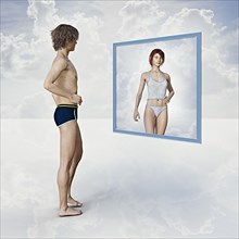 Man seeing reflection of woman in floating mirror