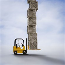 Robot driving forklift carrying tall pile of wooden crates