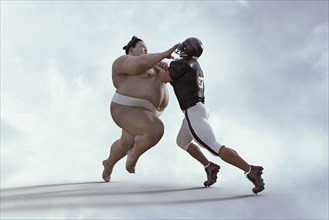 Sumo wrestler and football player battling