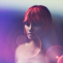 Pensive woman with red hair