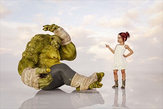 Girl scolding green ogre