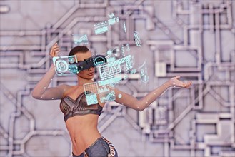 Woman wearing virtual reality goggles watching hologram