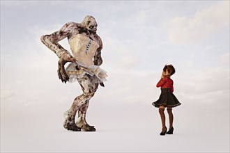 Girl examining alien wearing dress