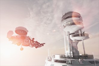 Man in futuristic tower waving to flying vehicle