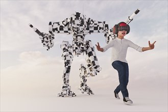 Boy wearing virtual reality goggles imitating robot soldier