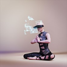 Woman wearing virtual reality goggles while meditating