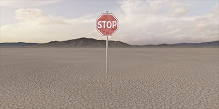 Stop sign in barren desert