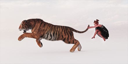 Girl holding tiger by the tail