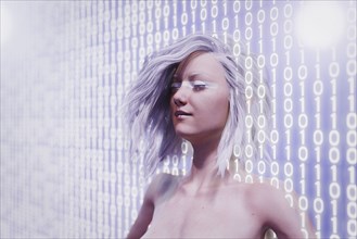Futuristic woman standing in binary code wall