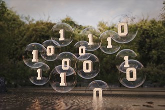 Binary code floating in bubbles above river