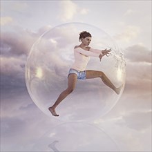 Woman escaping from cracking glass sphere