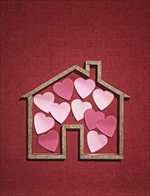 House shape with cutout hearts