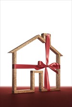 House shape wrapped in ribbon