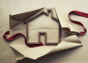 House shape in unwrapped gift