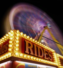 Blurred view of ferris wheel at amusement park