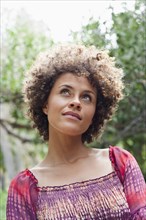 Mixed race woman looking up