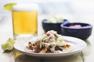 Plate of tacos with beer