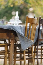 Tablecloth on empty table blowing in wind