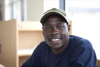 Smiling Black student in library