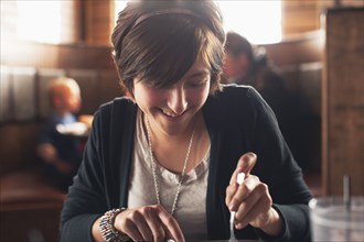 Caucasian teenager eating in restaurant