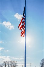 American flag hanging from flagpole outdoors