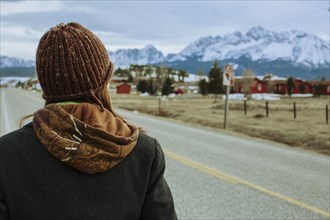 Caucasian woman walking on rural road