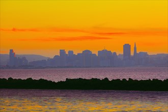 Colorful sunset sky over San Francisco city skyline