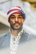 Mixed race man wearing American flag turban