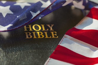American flag draped over bible