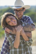 Caucasian couple hugging outdoors