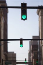 Green lights over city street