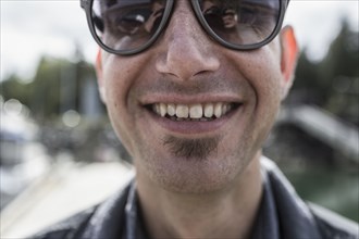 Close up of smiling Caucasian man with soul patch