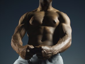African American man flexing muscles