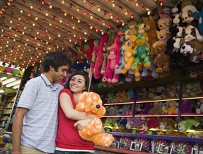 Multi-ethnic teenaged couple at carnival
