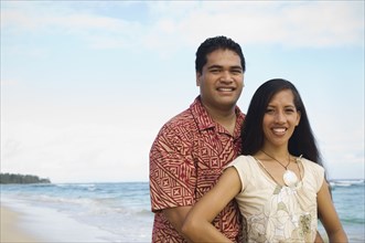 Pacific Islander couple at beach