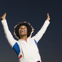 Confident African woman cheering