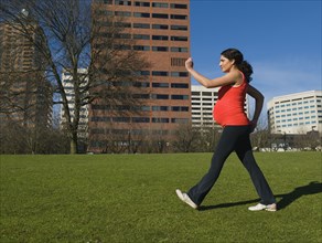 Pregnant Middle Eastern woman walking for exercise