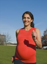 Pregnant Middle Eastern woman walking for exercise